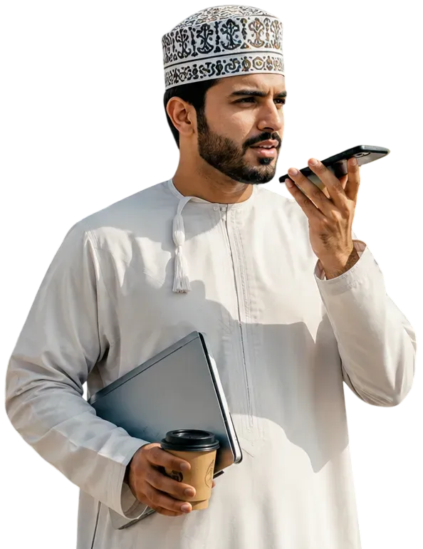 Omani man sending a voice note on his phone
